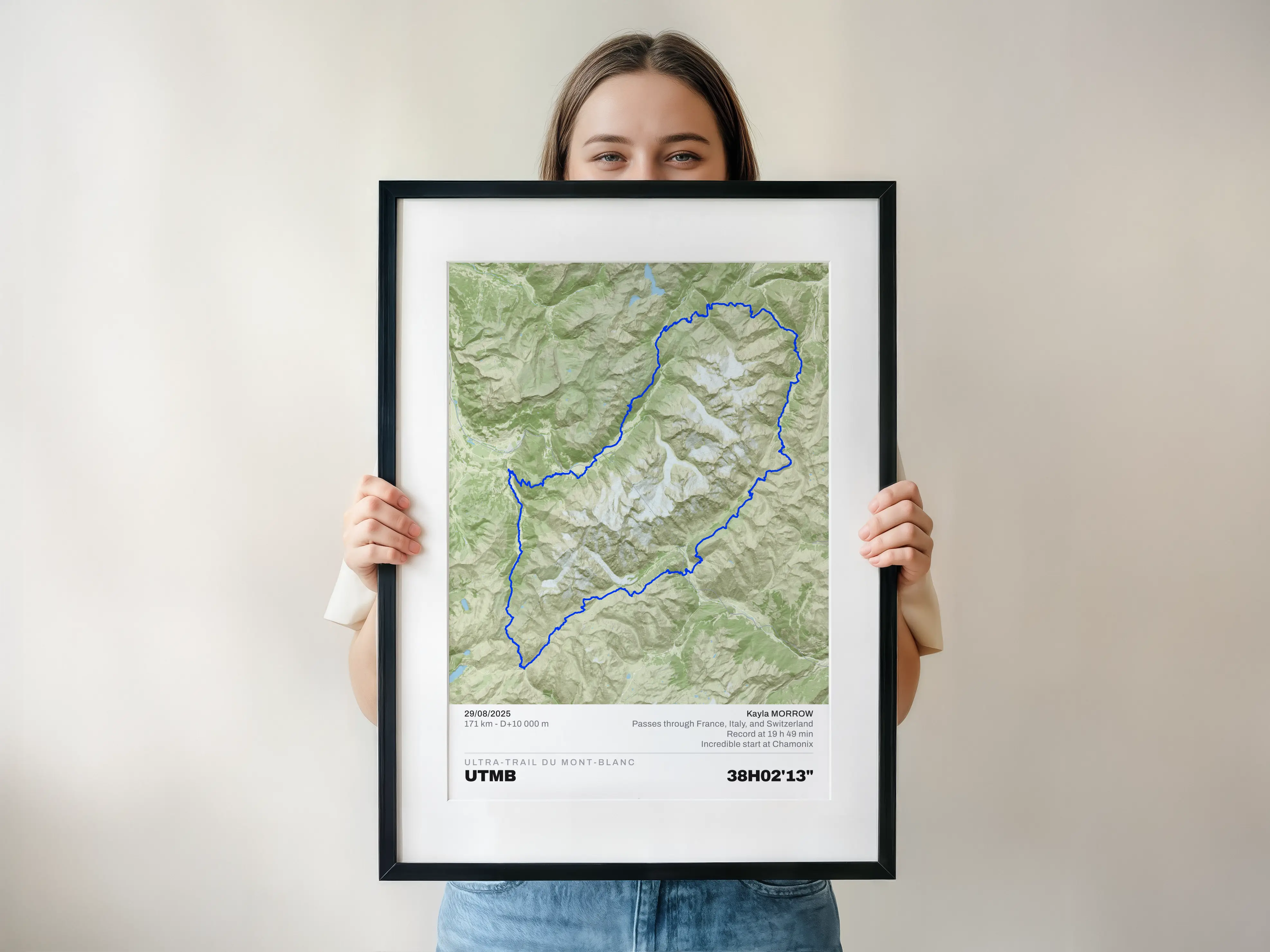 Woman holding an Elevaprint poster